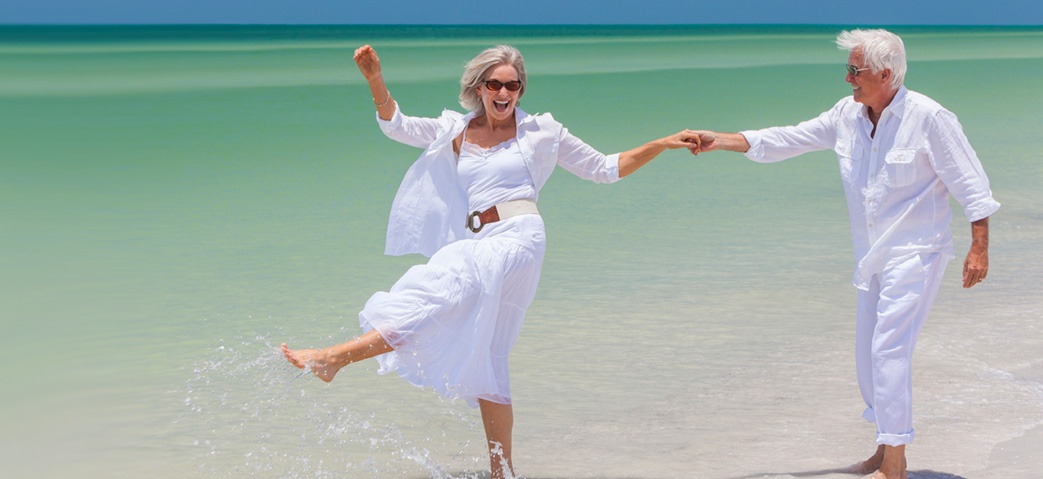 Healthy adults walking together on the beach