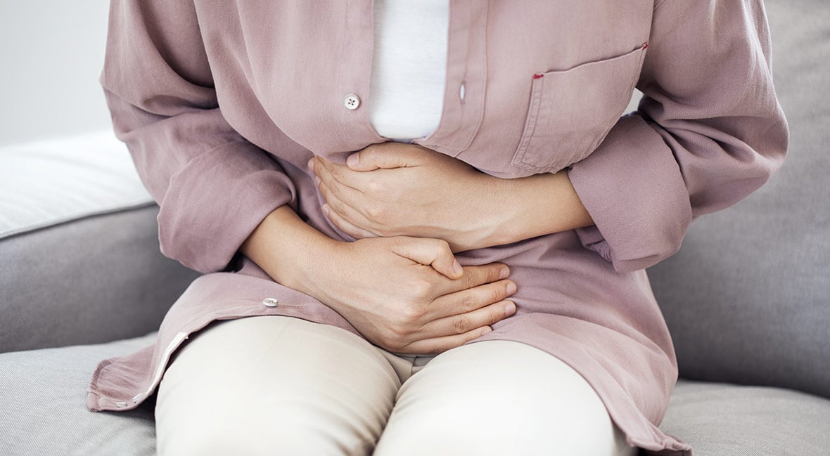 Young woman with stomach pain