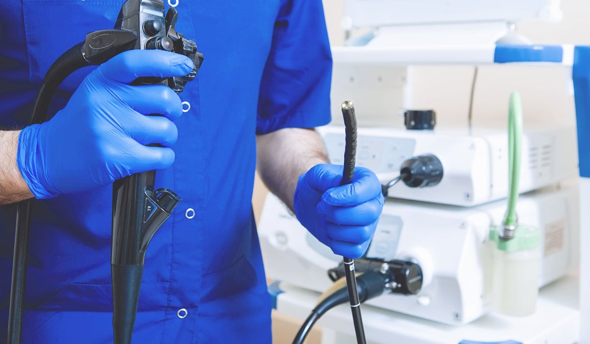 man holding colonoscopy device